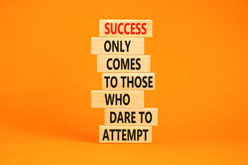 Success symbol. Concept words Success only comes to those who dare to attempt on wooden blocks. Beautiful orange background copy space. Business success and attempt concept.