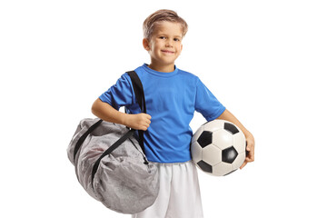 Full length portrait of a little boy in a sports jersey posing and holding a soccer ball and a...