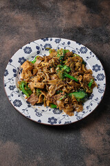 Delicious udon noodles with  beef  and brocolli
