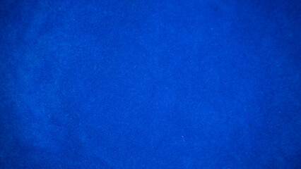 Dark blue velvet fabric texture used as background. Empty dark blue fabric background of soft and...