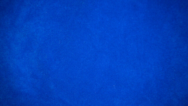 Dark blue velvet fabric texture used as background. Empty dark blue fabric background of soft and smooth textile material. There is space for text.