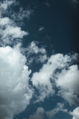 Dark blue sky with white clouds