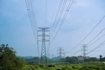 High voltage power tower industrial landscape at sunrise,urban power transmission lines.