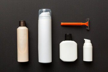shaving man set. shaving machine, towel, lotion and shaving foam on colored background. Men bath Accessories top view
