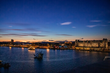 City of Oslo Norway in the Evening with Sunset, Sea, Historical buildings and Christmas decorations