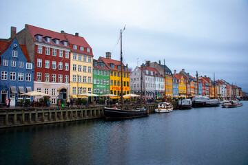 Fototapeta na wymiar Colorful houses line the Nyhavn canal in Copenhagen, Denmark