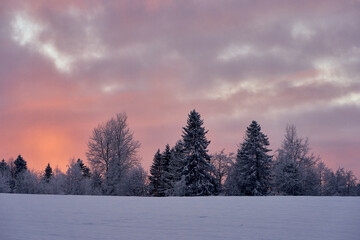 Evening clouds over the Olterudelva Valley in winter. Toten, Norway.