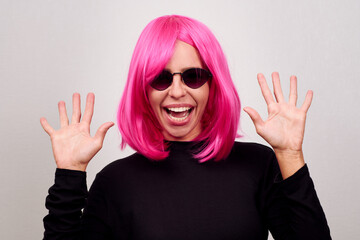 Woman with pink hair and sunglasses