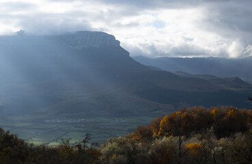 Forests with autumn colors in the Aralar mountain range and San Donato mountain in the background,...