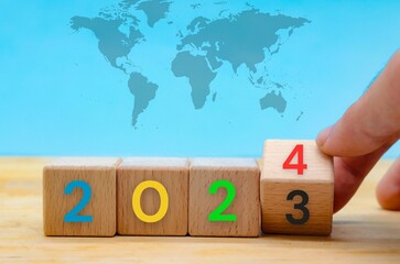 2024 of different colors in wooden block cubes on blue background
