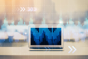 Forex Chart hologram on table with computer background. Multi exposure. Concept of financial markets.