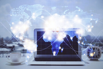 Double exposure of business theme icons and work space with computer background. Concept of success.