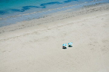 Fototapeta na wymiar vacation couple resting on white beach sand