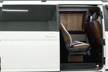 comfortable passenger bus interior with upholstered seats; individual transfer for a group of...