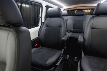 comfortable passenger bus interior with upholstered seats; individual transfer for a group of...