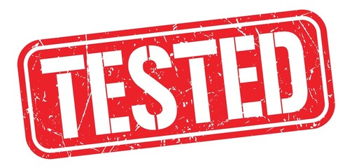 TESTED text written on red stamp sign. © outchill