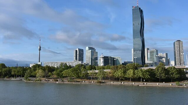 Vienna, Austria, August 2022. The urban landscape of the modern part of the city: the uno city. The tower of the Danube tower Donauturm and the black skyscraper DC stand out. Tilt movement