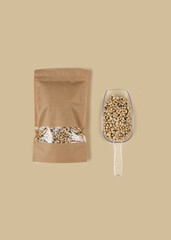 Brown kraft paper doypack bags with black-eyed peas on a yellow background. Packaging for foods and goods template mock-up. Packs with windows for weight products.