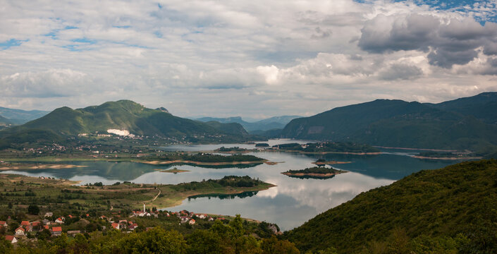 Mountain lake and villages surrounded by mountains
