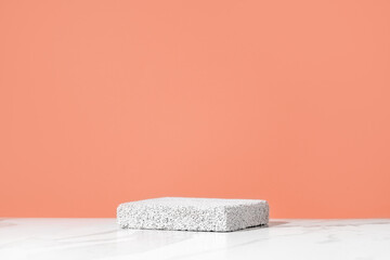 Empty podium for cosmetics beauty product presentation. Made with pumice stone on a bathroom table. Front view. - obrazy, fototapety, plakaty