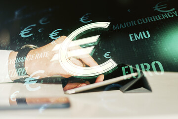 Creative EURO symbols illustration and finger presses on a digital tablet on background, forex and currency concept. Multiexposure