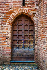 A medieval castle door with studs
