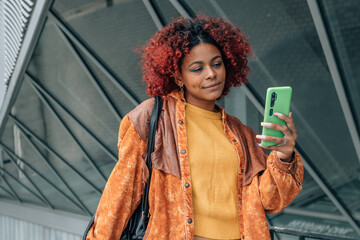 girl with mobile phone in the street