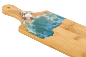 marine decor made of epoxy resin on a wooden cutting board close-up