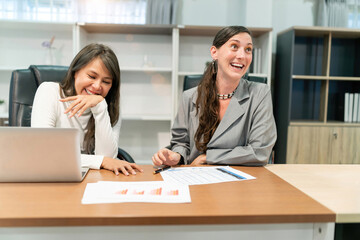 business caucasian and asian woman laugh. disrespectful boss joking at funny candidate hiring for company benefit. manager chuckle make fun of new recruitment while consider suitable office position
