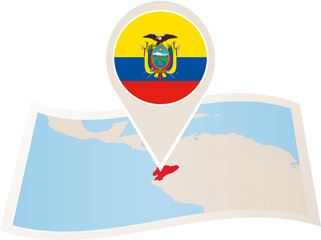 Folded paper map of Ecuador with flag pin of Ecuador.
