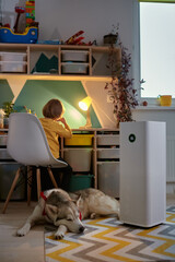 Air purifier in the children's room with an allergy child and a dog