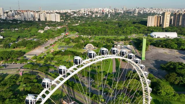 Sao Paulo Brazil. Major Ferris Wheel  Entertainment of Latin America at downtown Sao Paulo Brazil. Ferris wheel at amusement park. Entertainment attraction scenery. Villa Lobos Park. Tourism landmark.