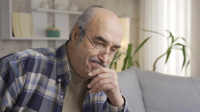 Worried Old Man Lost In Thoughts. Loneliness And Retirement.
Old Man Suffering From Psychological Distress, Bored And Overwhelmed At Home Alone.
