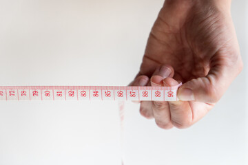 Woman hand pointing 90cm on meter with white background