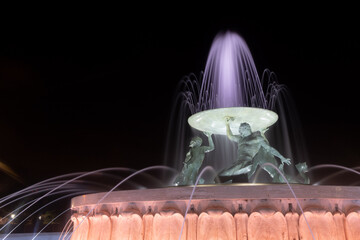 triton fountain at night