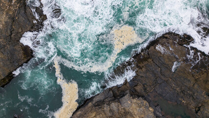 Fototapeta premium Aerial shot of the pacific ocean at Pichilemu, Chile