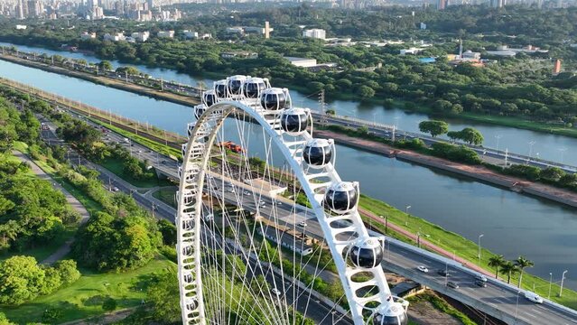 Sao Paulo Brazil. Major Ferris Wheel  Entertainment of Latin America at downtown Sao Paulo Brazil. Ferris wheel at amusement park. Entertainment attraction scenery. Villa Lobos Park. Tourism landmark.