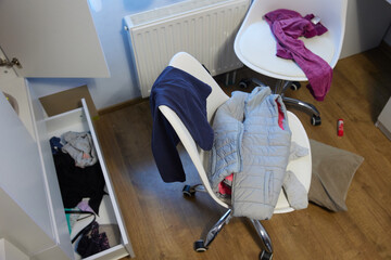 mess, disorder and interior concept - view of messy home kid's room with scattered stuff