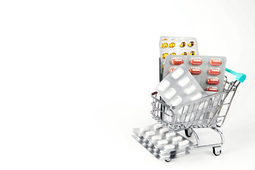 Shopping cart with many pills and drugs. free space for text. High quality photo