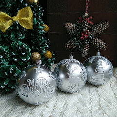 Christmas balls of silver color on the background of cones and stars. decorative composition for home decoration during the celebration of christmas and new year