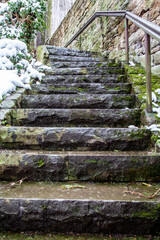 Ancient stone stairs covered with snow