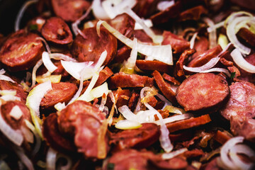 Brazilian fried sausage, with onion and sauce, typical food from Brazil in the state of Minas Gerais