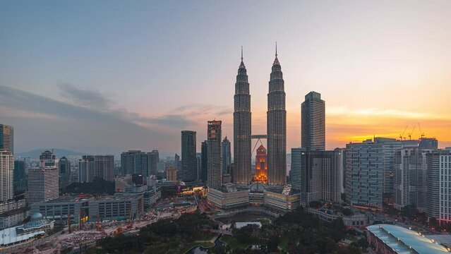 Day to night time-lapse of Kuala Lumpur, Malaysia at sunset. Prores 4KUHD