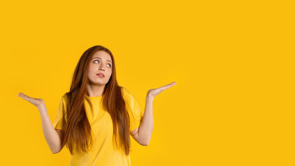 Confused pretty woman, shoulders up - can't help, makes gesture of I dont know. Difficult question, guilty reaction, puzzled stylish woman on yellow background. - obrazy, fototapety, plakaty