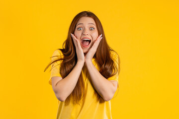 Shocked woman glad, she screaming WOW. Impressed lady trying to get attention. Concept of summer sales, profitable offer. Excited happy girl on yellow background.