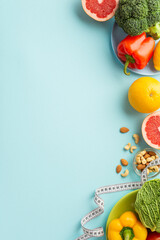 Slimming concept. Top view vertical photo of plates with fruits and vegetables cabbage pepper...