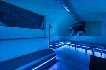Entertainment room in an underground venue in a nightlife venue with rgb neon lighting and...