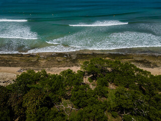 Beautiful aerial view of the Avellanas Mangrove, its iconic bridge, and the magical beach in Costa...