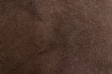 Dark brown cracked leather texture background	