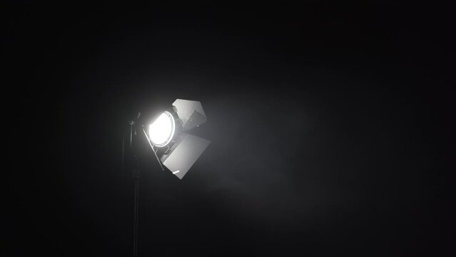 Spotlight light for the stage. Shots of studio lighting. Lighting equipment. Lighting designer. Theatrical smoke. Art and creativity. 4K frames.